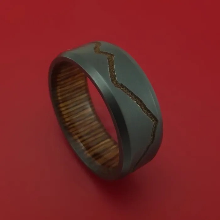 Rings Lashbrook Black Zirconium Ring with GoldToned Milled Mountain Range Design Inlay and Interior Hardwood Sleeve Custom Made Band Rings Lashbrook Black Zirconium Ring with GoldToned Milled Mountain Range Design Inlay and Interior Hardwood Sleeve Custom Made Band