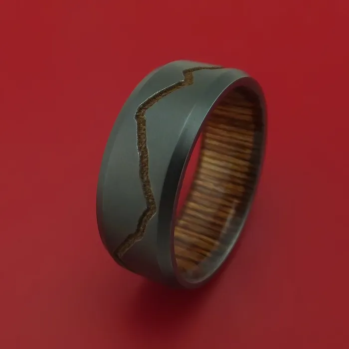 Rings Lashbrook Black Zirconium Ring with GoldToned Milled Mountain Range Design Inlay and Interior Hardwood Sleeve Custom Made Band Rings Lashbrook Black Zirconium Ring with GoldToned Milled Mountain Range Design Inlay and Interior Hardwood Sleeve Custom Made Band